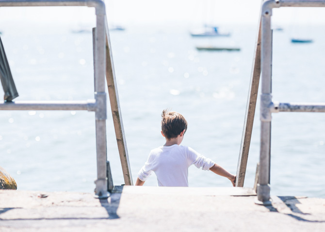 Boy walking down stairs